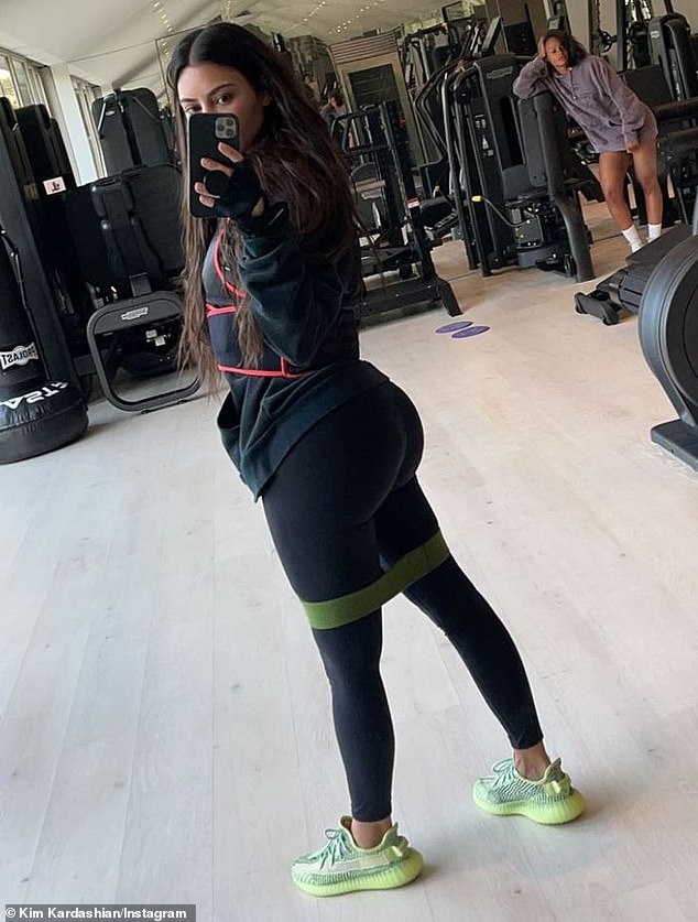 Kim Kardashian hits the gym wearing Kanye West's Yeezy shoes... amid