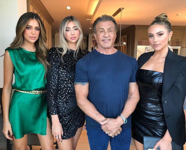 Sylvester-Stallone-poses-with-stunning-daughters