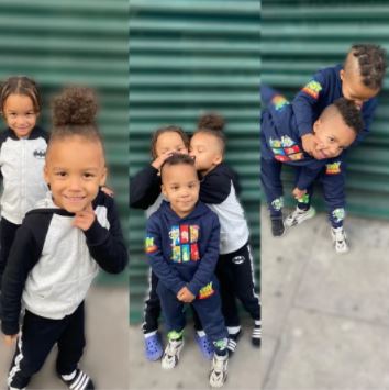 A woman has been arrested on suspicion of child neglect after four boys died in a house fire.