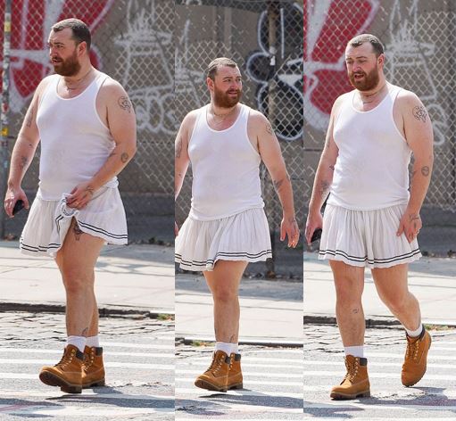 Sam Smith dons a white skirt and a matching tank top while taking a ...