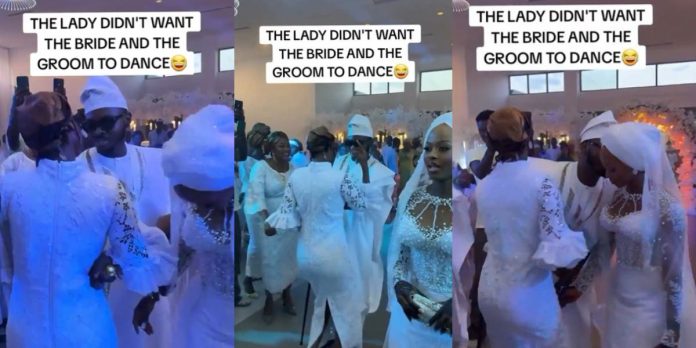 Lady publicly interrupts wedding as she refuses to allow the groom to dance with his bride (Video)